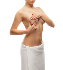 Naklejka premium Woman examining breast isolated on white background 