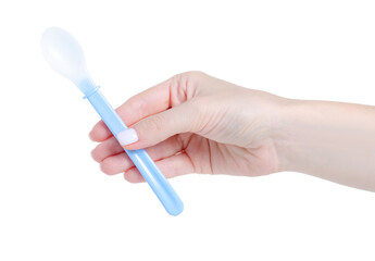 Blue baby spoon in hand on white background isolation