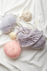 Fototapeta na wymiar Balls of wool and mohair for knitting in pastel colors