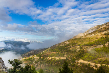 Fototapeta premium Confrides mountain´s port in the morning one day with low fog and clouds.