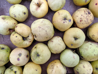 green apples in a box near