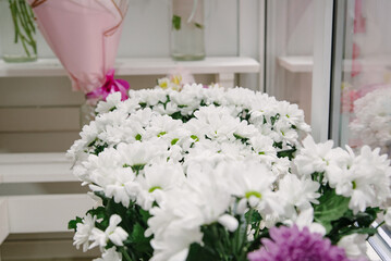 Flower shop concept. Close-up beautiful lovely bouquet of mixed flowers on wooden table.