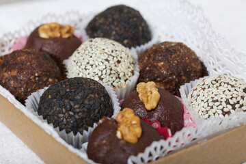 Cardboard packaging with dried fruit and nuts sweets. Made at home in self-isolation during the epidemic.