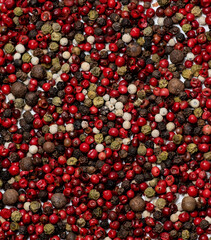 mix of red, white, green and black peppers, background