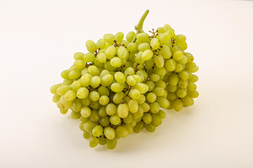Green grape branch over background