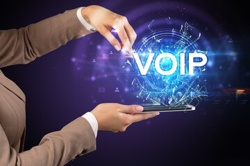 Close-up of a touchscreen with VOIP abbreviation, modern technology concept