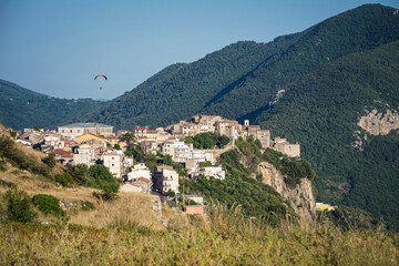 Fototapeta na wymiar Beautiful Norma village with ancient romanesque ruins and medieval houses on the top of the hill. Traditional Italian landscape