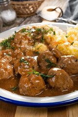 Minced meat balls in mushroom sauce.