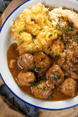 Minced meat balls in mushroom sauce.