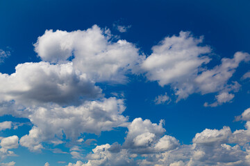 Fluffy white  clouds  on a blue sky.