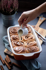Fresh baked homemade cinnamon rolls with icing, real autumn vibes