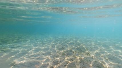 Fototapeta na wymiar Underwater Aegean sea paradise beach with emerald - turquoise sea, Greece