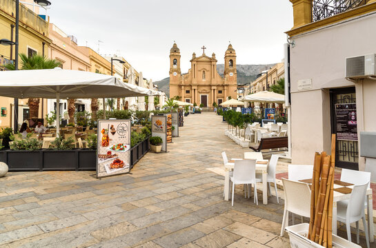 Terrasini, Sicily, Italy - September 25, 2020: View of Duomo Square with outdoor bars, restaurants and Church in the center of Terrasini, province of Palermo, Sicily