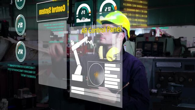 Factory worker use future holographic screen device to control manufacturing machine in factory . Concept of futuristic automation technology , virtual augmented reality and smart visualization .