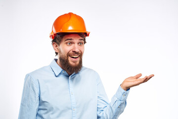 Man in shirt orange helmet safety emotions construction professional cropped view
