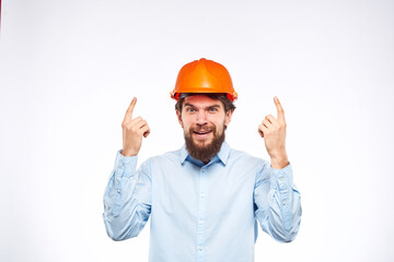 emotional men orange helmet engineer construction industry lifestyle cropped view