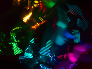 Fototapeta na wymiar light painting photography, waves of vibrant color against a black background. Long exposure photo of vibrant fairy lights in abstract