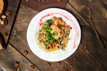 Chicken breast with mushroom sauce and vegetables