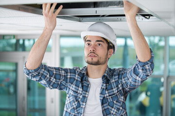 man working on the ceiling