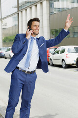 portrait of a man calling for a taxi