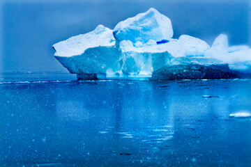 Snowing Blue Iceberg Reflection Paradise Bay Skintorp Cove Antarctica