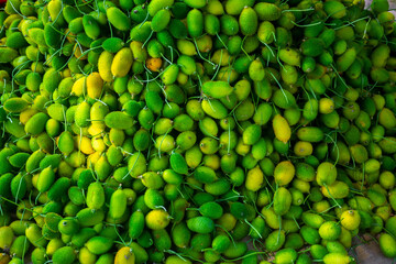 Fresh and green spiny gourd vegetables ready for sale in the market.