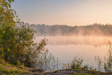 Fototapeta na wymiar foggy misty lake
