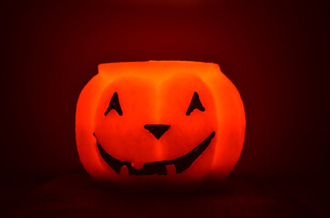 Festive orange candle pumpkin at night in the hands. Magic. Shine. Halloween. postcard, headband.