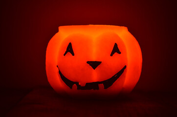 Festive orange candle pumpkin at night in the hands. Magic. Shine. Halloween. postcard, headband.