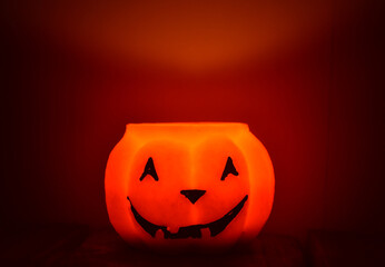 Festive orange candle pumpkin at night in the hands. Magic. Shine. Halloween. postcard, headband.