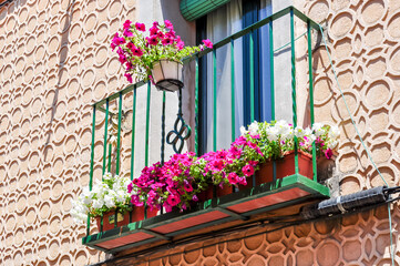 Fototapeta na wymiar Flowers on balcony in Segovia, Spain