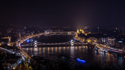 Fototapeta na wymiar Panorama of the city, Danube river, and Hungarian Parliament Building. Night in Budapest, Hungary.