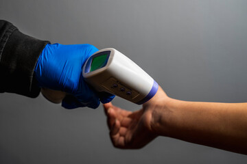 Medical infrared thermometer use body.To measure the temperature of the incoming people /wrist area...