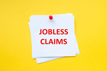 Jobless claims. Word on white sticker with yellow background