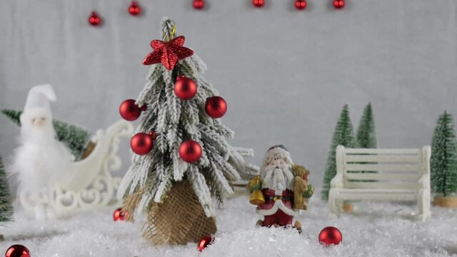 Christmas decorations background. radiating Christmas spirit and mood. The green tree is decorated with red balls.