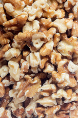 A pile of peeled walnuts piled up. Preparation of healthy desserts.