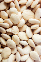 Close-up of a group of white almonds. Organic texture background.