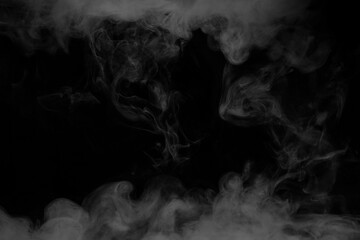 Abstract white smoke moves on black background. Swirling smoke.