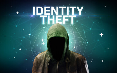 Mysterious hacker with IDENTITY THEFT inscription, online attack concept inscription, online...
