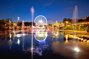 Fototapeta na wymiar City of Nice ferris wheel and fountain evening mirror view