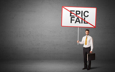 business person holding a traffic sign with EPIC FAIL inscription, new idea concept
