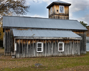 Old wood barn with metal roof and cupola on top