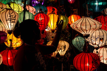 person and lanterns 