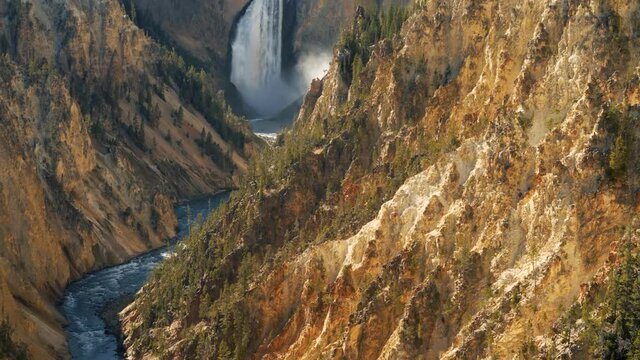 Tilt up-rugged Grand Canyon of the Yellowstone River gorge to beautiful Lower Yellowstone Falls