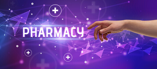 Close-Up of cropped hand pointing at PHARMACY inscription, medical concept