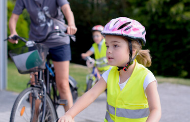 parent and child riding bikes