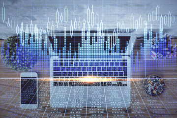 Multi exposure of financial chart drawing over table background with computer. Concept of research and analysis. Top view.