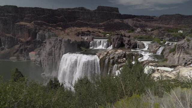 Waterfalls Flowing into Gorgeous River Canyon | Shoshone Falls | 4K
