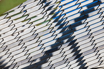 Abstract metal grid on oil processing plant. Closeup of oil distillation tower (refining column)....
