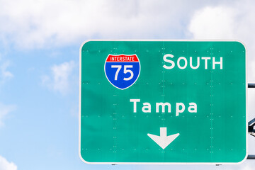 Tampa, USA road street interstate highway green sign for i75 south to Tampa Florida with text isolated closeup and sky